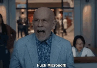 a frame from space force, john malkovich screams fuck microsoft